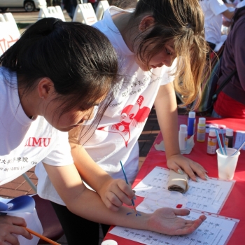 Students practicing Chinese writing